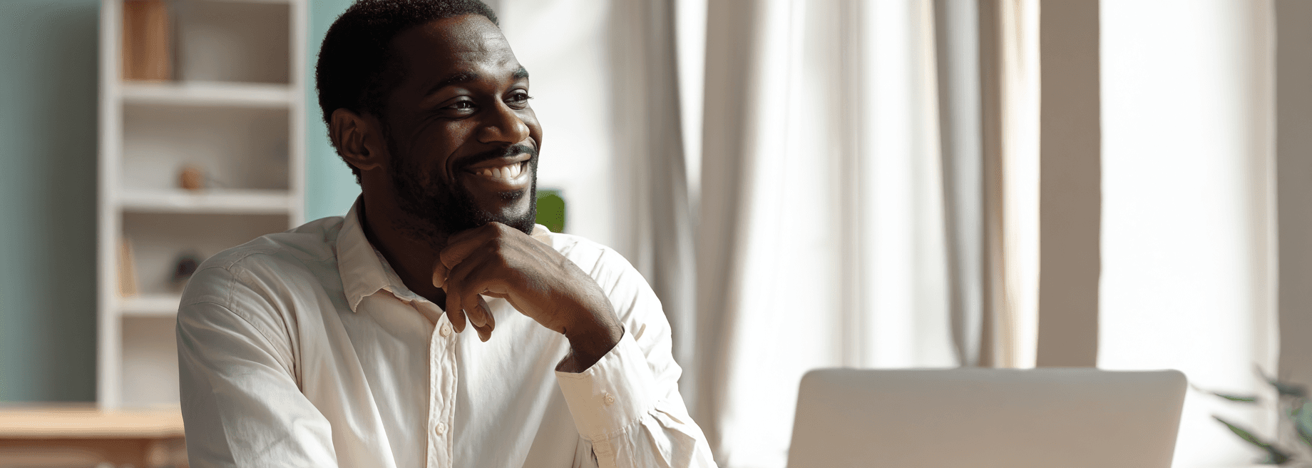 Professional consultant working in a bright home office with laptop